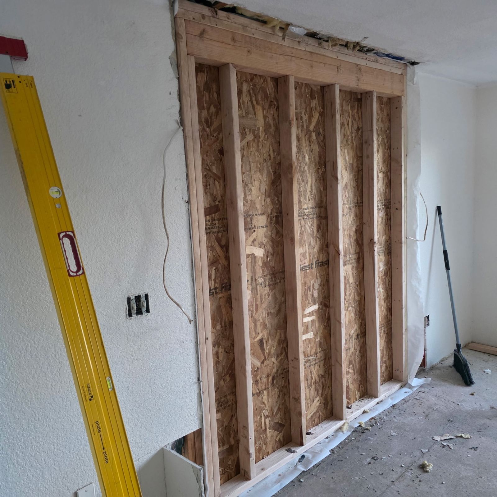 Interior wall opened and re-framed with new sheathing