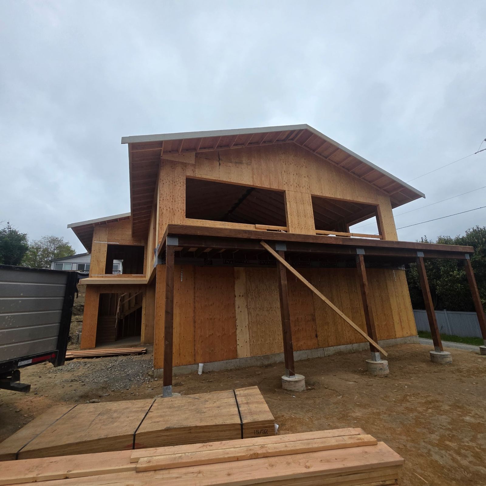 New home with framed covered porch and post-and-beam supports
