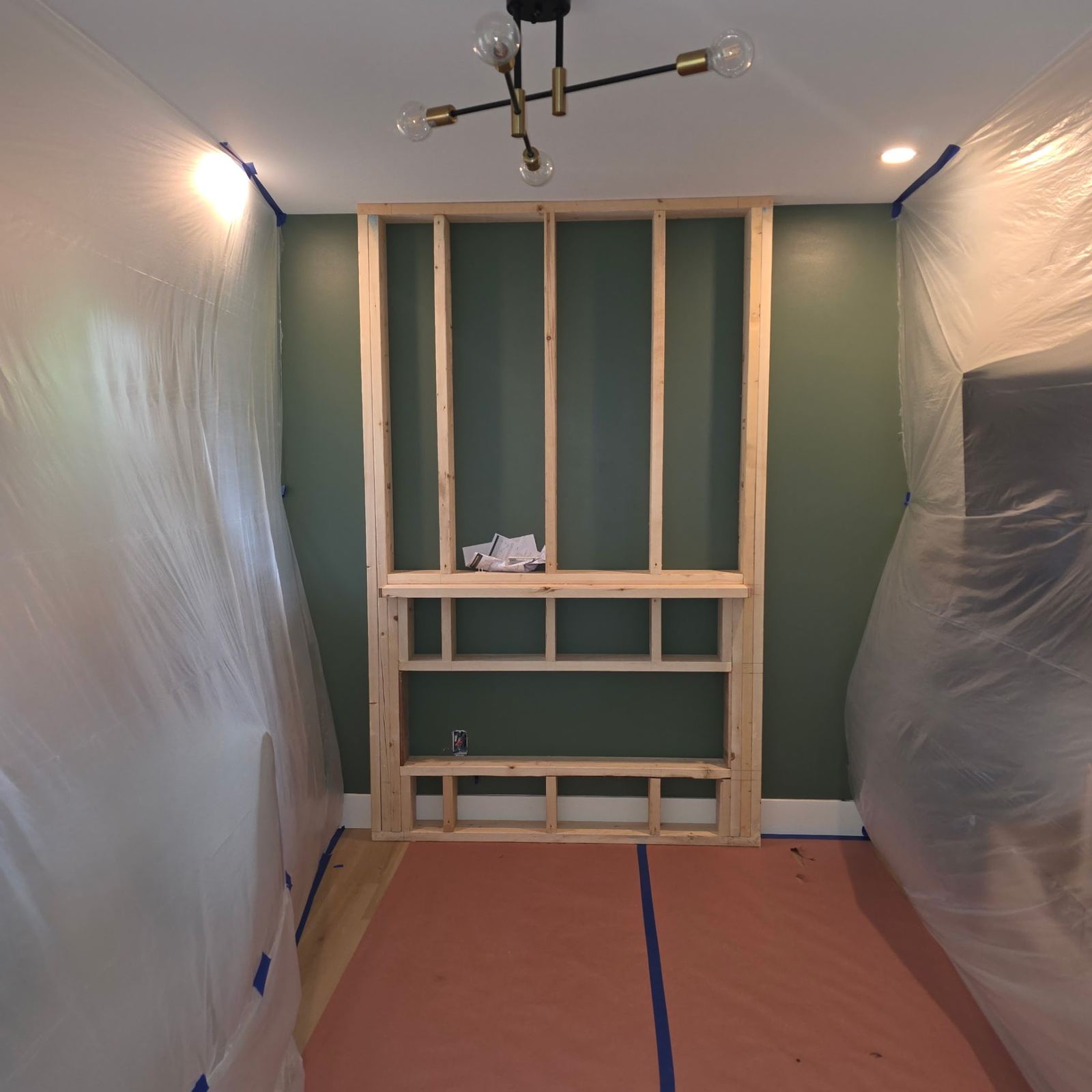 Interior built-in shelving framed into a remodeled room