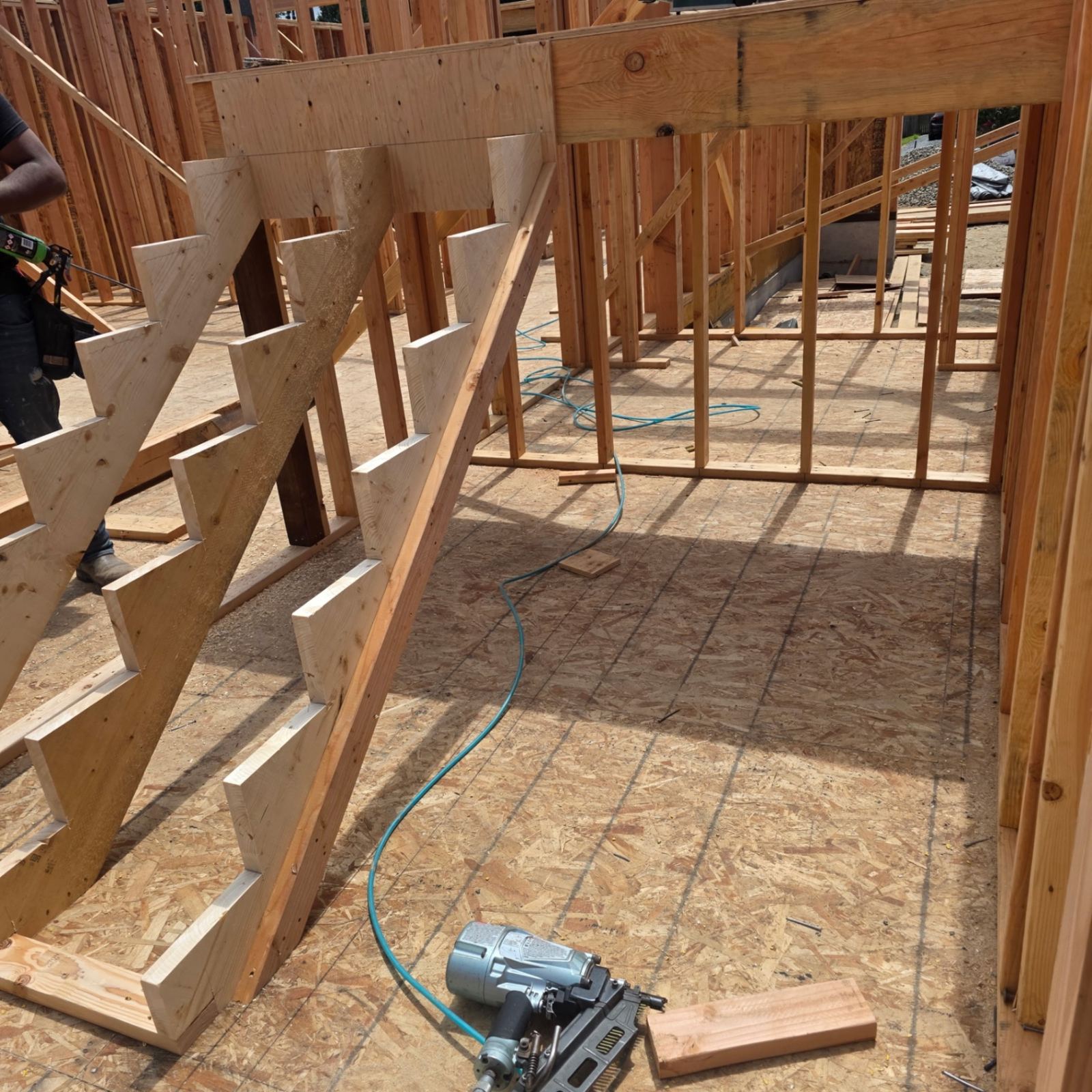 Framed stair stringers set in place inside a new construction home